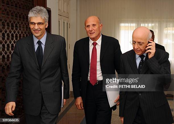 Tunisian Prime Minister Mohamed Ghannouchi with Tunisian International Cooperation Nouri Jouini and Regional Development Nejib Chebbi arrive to meet...