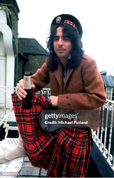 Alice Cooper, portrait, wearing a tartan kilt, London, 1972.