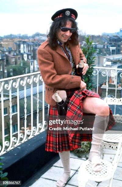 Alice Cooper, portrait, wearing a tartan kilt, London, 1972.