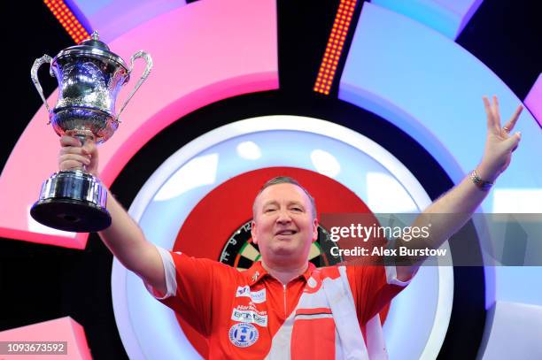 Glen Durrant of England celebrates with the BDO Lakeside Professional Men's Championship 2019 Trophy after winning the final against Scott Waites of...