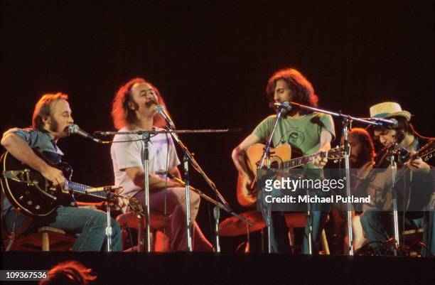 Crosby Stills Nash and Young perform on stage at Wembley Stadium, London, 14th September 1974, L-R Stephen Stills, David Crosby, Graham Nash, Neil...