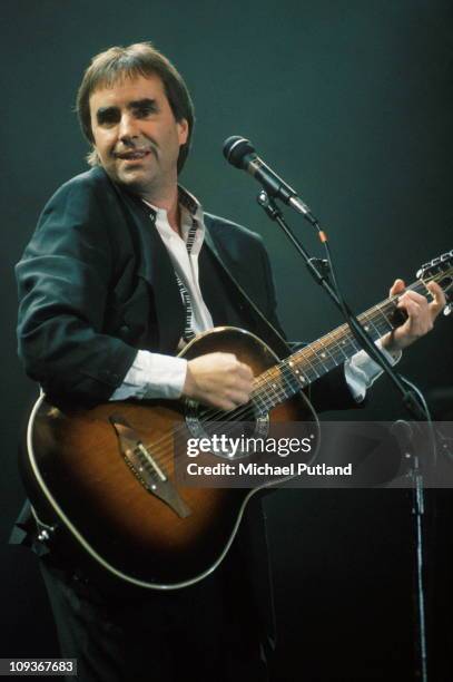 Chris DeBurgh performs on stage, UK, 1983.