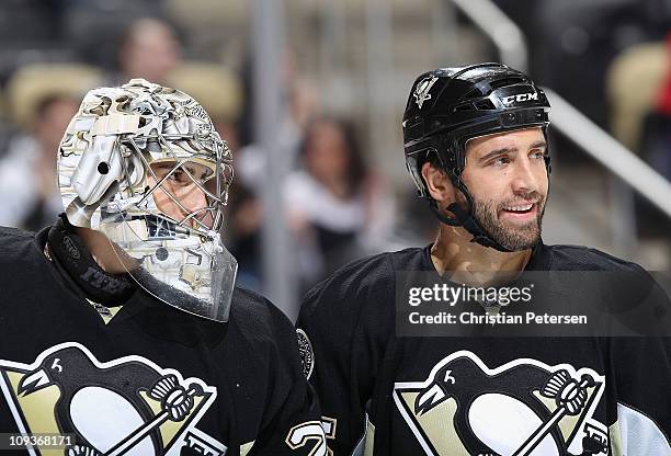 Goaltender Marc-Andre Fleury and Maxime Talbot of the Pittsburgh Penguins talk during the NHL game against the Washington Capitals at Consol Energy...