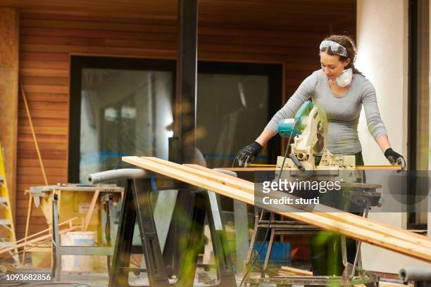 female homebuilder - power tool stock pictures, royalty-free photos & images