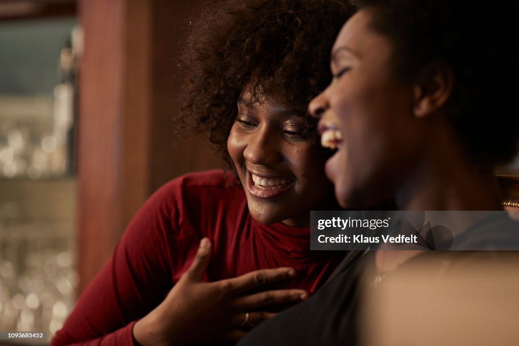 Young women ordering Christmas gifts online with creditcard