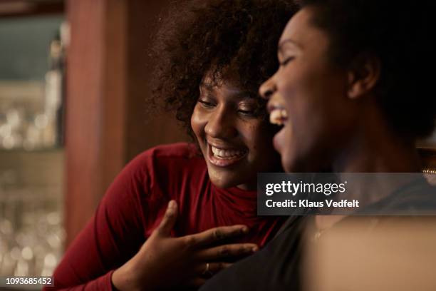 young women ordering christmas gifts online with creditcard - black woman laughing stock pictures, royalty-free photos & images