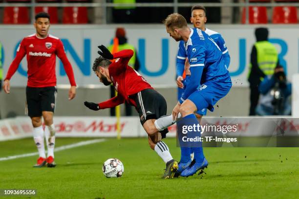 Christian Traesch of FC Ingolstadt 04 and Jan Kirchhoff of 1. FC Magdeburg battle for the ball during the Second Bundesliga match between FC...