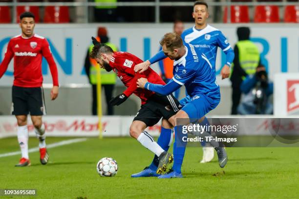 Christian Traesch of FC Ingolstadt 04 and Jan Kirchhoff of 1. FC Magdeburg battle for the ball during the Second Bundesliga match between FC...