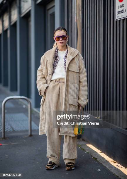 Guest is seen wearing beige corduroy coat and pants outside MSGM during Milan Menswear Fashion Week Autumn/Winter 2019/20 on January 13, 2019 in...