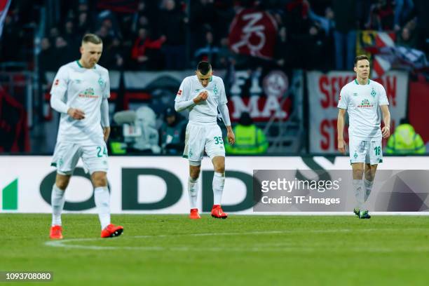 Johannes Eggestein of SV Werder Bremen, Maximilian Eggestein of SV Werder Bremen and Niklas Moisander of SV Werder Bremen looks dejected during the...