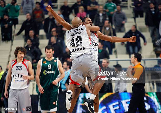 Arvydas Siksnius, #8 and Khalid El-Amin, #42 of Lietuvos Rytas celebrate their victory during the 2010-2011 Turkish Airlines Euroleague Top 16 Date 5...