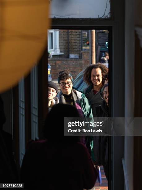 group of friends arriving at a house party - indian arrival stock pictures, royalty-free photos & images