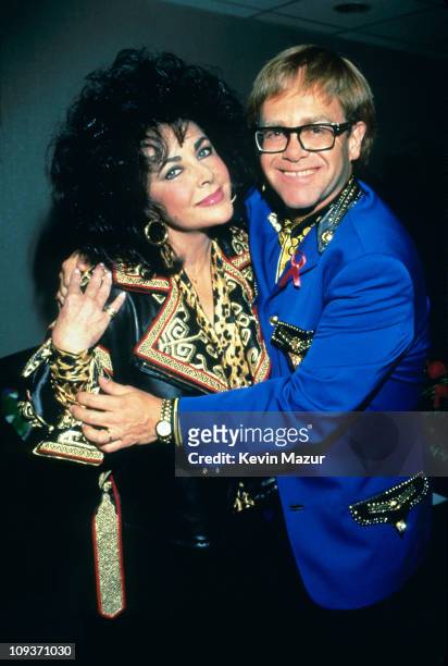 Elizabeth Taylor and Elton John backstage before Elton John performs at Shea Stadium on August 21, 1992 in New York City.