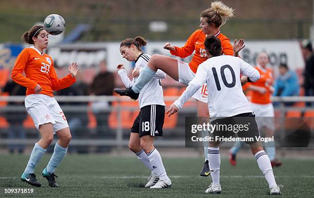 Anja Maike Hegenauer , Kyra Malinowski of Germany, Tessel Middag and Maud Roetgering of Netherlands compete for the ball during the Women's...