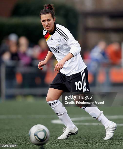 Kyra Malinowski of Germany runs with the ball during the Women's International friendly match between Germany and Netherlands on February 23, 2011 in...