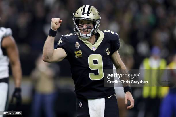 Drew Brees of the New Orleans Saints celebrates his second quarter touchdown pass against the Philadelphia Eagles in the NFC Divisional Playoff Game...