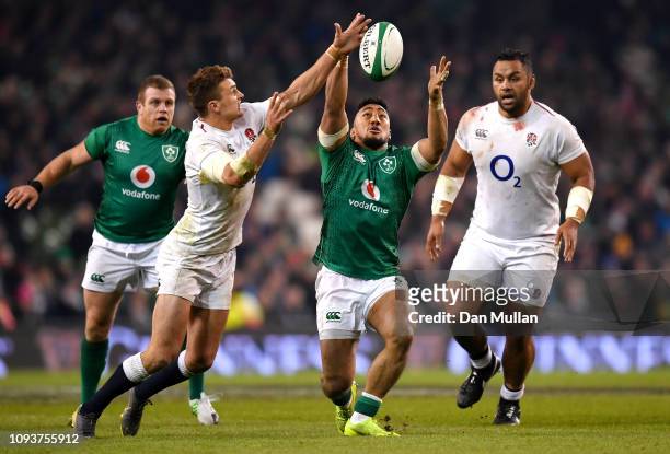 Henry Slade of England steals the ball from Bundee Aki of Ireland during the Guinness Six Nations between Ireland and England at Aviva Stadium on...