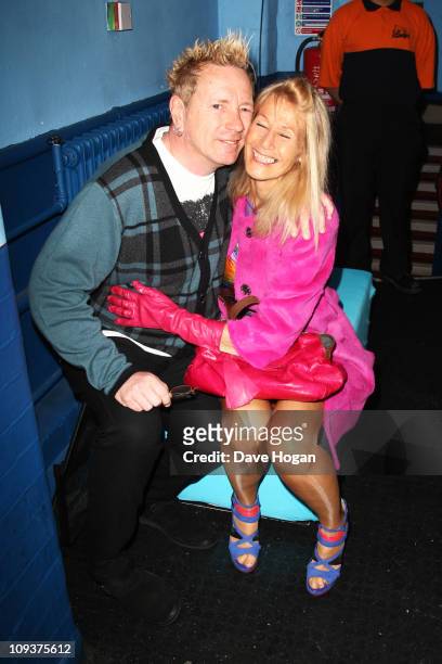 John Lydon formally of The Sex Pistols and Pil and his wife Nora Forster pose in front of the winners boards at the Shockwaves NME Awards 2011 held...