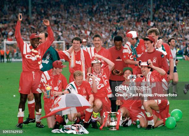 Liverpool players celebrate with the trophy after the FA Cup Final between Liverpool and Sunderland at Wembley Stadium on May 9, 1992 in London,...
