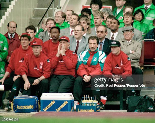 Liverpool manager Graeme Souness sitting in the dugout alongside his caretaker Ronnie Moran who is seen shouting instructions during the FA Cup Final...