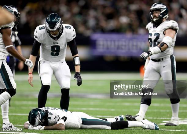 Alshon Jeffery of the Philadelphia Eagles is consoled by Nick Foles after allowing a pass to go through his hands that led to an interception late in...