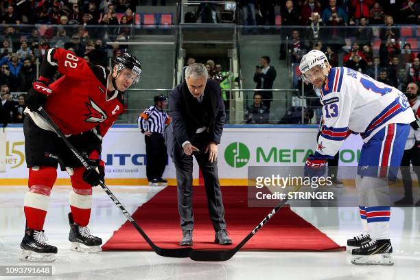 Former Manchester United's Portuguese manager Jose Mourinho drops the puck to start a Continental hockey league match between Avangard Omsk and SKA...