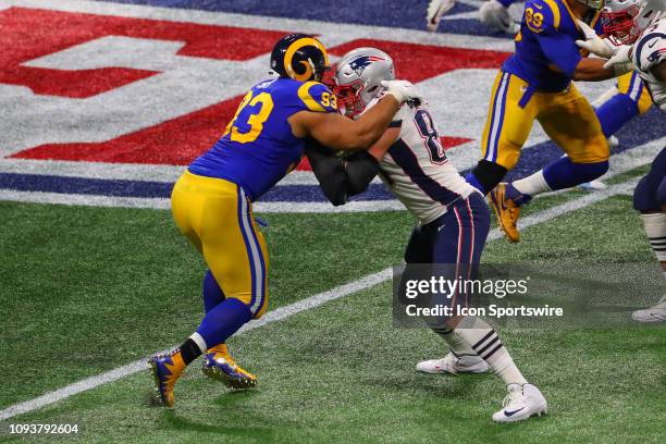 Los Angeles Rams nose tackle Ndamukong Suh battles New England Patriots tight end Rob Gronkowski during the second quarter of Super Bowl LIII between...