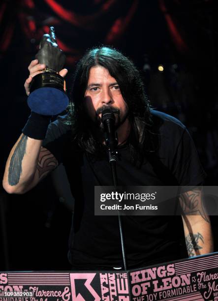 Dave Grohl of Foo Fighters excepts the award for 'Godlike Genius' during the NME Awards 2011 at Brixton Academy on February 23, 2011 in London,...