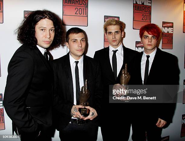 Ray Toro, Frank Iero, Mikey Way and Gerard Way of My Chemical Romance pose against the Shockwaves NME Awards 2011 winners boards with their award for...