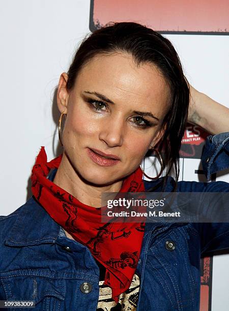 Singer Juliette Lewis poses against the Shockwaves NME Awards 2011 winners boards at Brixton Academy on February 23, 2011 in London, England.