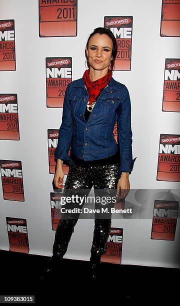 Singer Juliette Lewis poses against the Shockwaves NME Awards 2011 winners boards at Brixton Academy on February 23, 2011 in London, England.