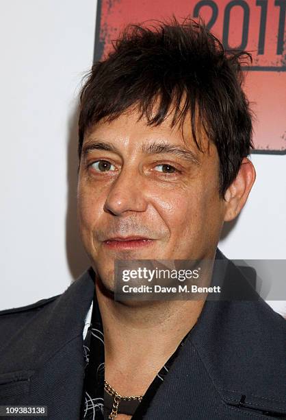 Jamie Hince of The Kills poses against the Shockwaves NME Awards 2011 winners boards at Brixton Academy on February 23, 2011 in London, England.