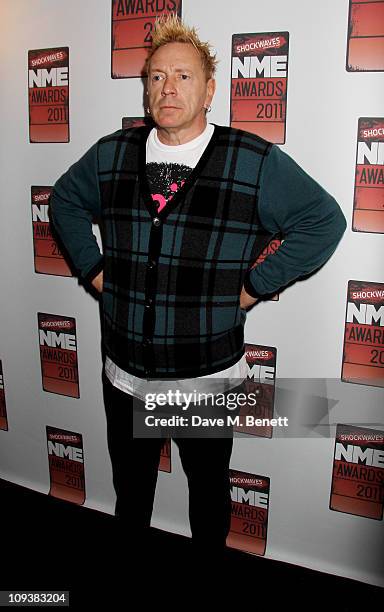 John Lydon poses against the Shockwaves NME Awards 2011 winners boards at Brixton Academy on February 23, 2011 in London, England.