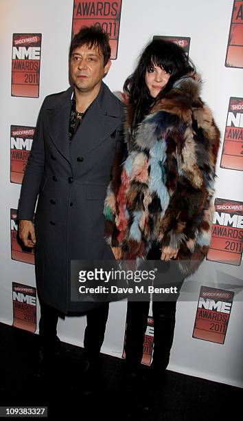 Jamie Hince and Alison Mosshart of The Kills pose against the Shockwaves NME Awards 2011 winners boards at Brixton Academy on February 23, 2011 in...