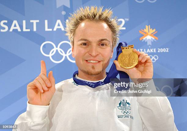 Steven Bradbury shows off his gold medal during the Team Australia Press Conference at the Main Media Center during the 2002 Salt Lake Winter...