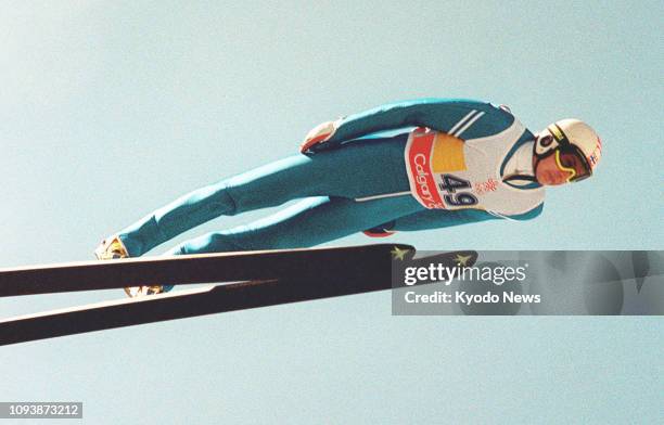 File photo shows Finnish ski jumping legend Matti Nykanen soaring through the air in the men's 90-meter event at the 1988 Winter Olympics in Calgary,...