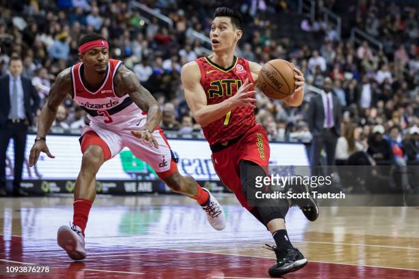Jeremy Lin of the Atlanta Hawks drives to the basket against Bradley Beal of the Washington Wizards during the second half at Capital One Arena on...