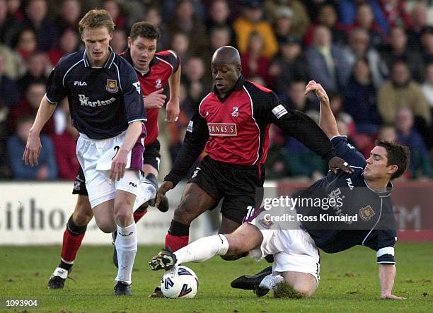 Paul Hall of Walsall is challenged by Hannu Tihinen and Frank Lampard of West Ham during the AXA FA Cup third round tie between Walsall and West Ham...