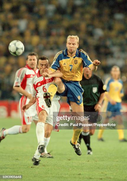 Hakan Mild of Sweden and Arif Erdem of Turkey battle for the ball during a UEFA Euro 2000 Group B match at the Philips Stadion on June 15, 2000 in...