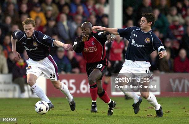 Paul Hall of Walsall is challenged by Hannu Tihinen and Frank Lampard of West Ham during the AXA FA Cup third round tie between Walsall and West Ham...