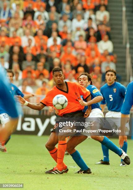 Patrick Kluivert of the Netherlands has his shirt pulled by Alessandro Nesta of Italy during the UEFA Euro 2000 Semi Final at the Amsterdam Arena on...