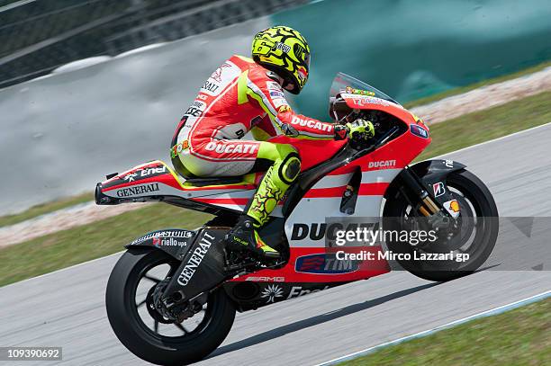 Valentino Rossi of Italy and Ducati Marlboro Team heads down a straight during the third day of testing at Sepang Circuit on February 24, 2011 in...