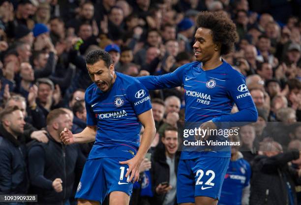 Pedro of Chelsea celebrates his goal with Willian during the Premier League match between Chelsea FC and Newcastle United FC at Stamford Bridge on...