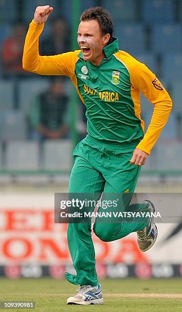 South African cricketer Johan Botha reacts after taking the wicket of West Indies batsman Chris Gayle during the Cricket World Cup match between...