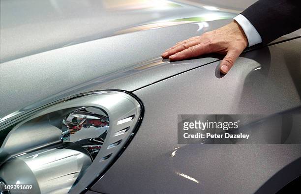 businessman loves his car - automobile foto e immagini stock