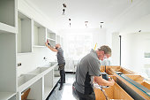 joinery team fitting a kitchen
