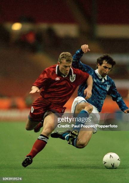 Alan Shearer of England is tackled by Vaios Karagiannis of Greece during an International Friendly at Wembley Stadium on May 17, 1994 in London,...