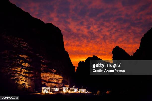 tourist tents in wadi rum desert at sunset. jordan. - arabian tent stock-fotos und bilder