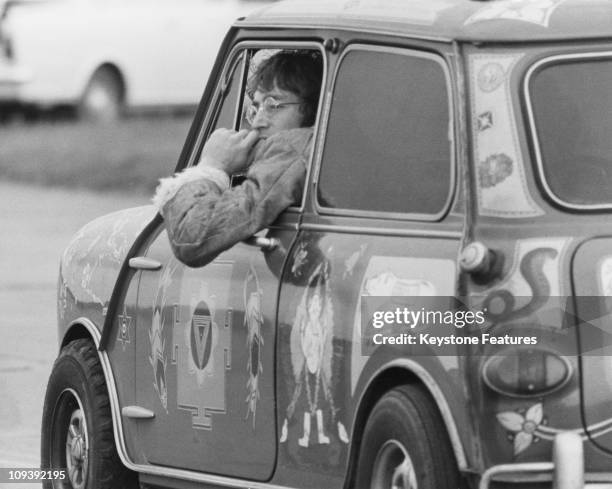 Singer and songwriter John Lennon of the Beatles, in a psychedelic Radford Mini de Ville owned by George Harrison at West Malling Airfield, Kent, 7th...