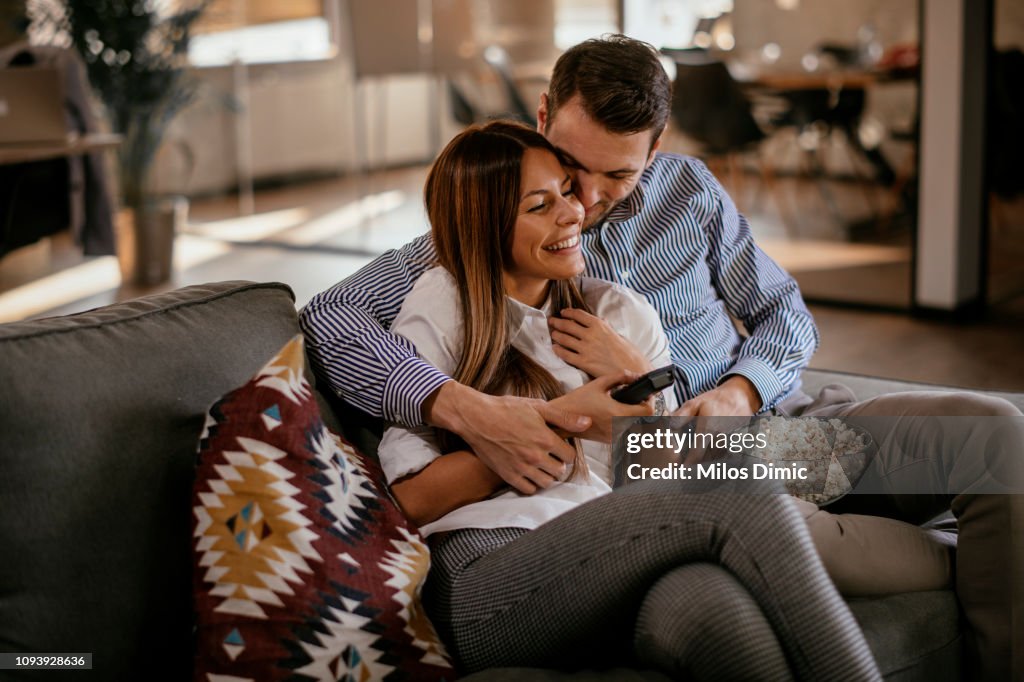 Couple at home watching TV